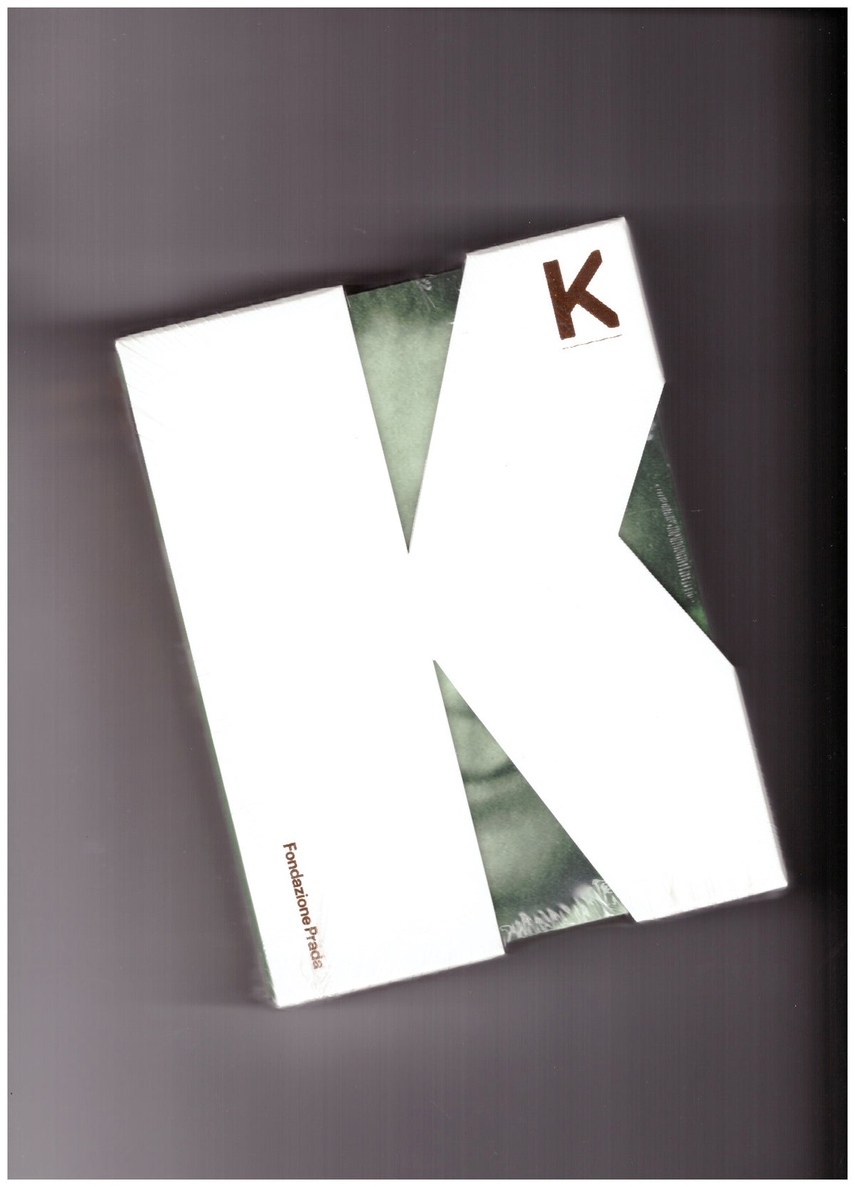 K – Martin Kippenberger’s “The Happy End of Franz Kafka’s Amerika” accompanied by Orson Welles’ film “The Trial” and Tangerine Dream’s album “The Castle”